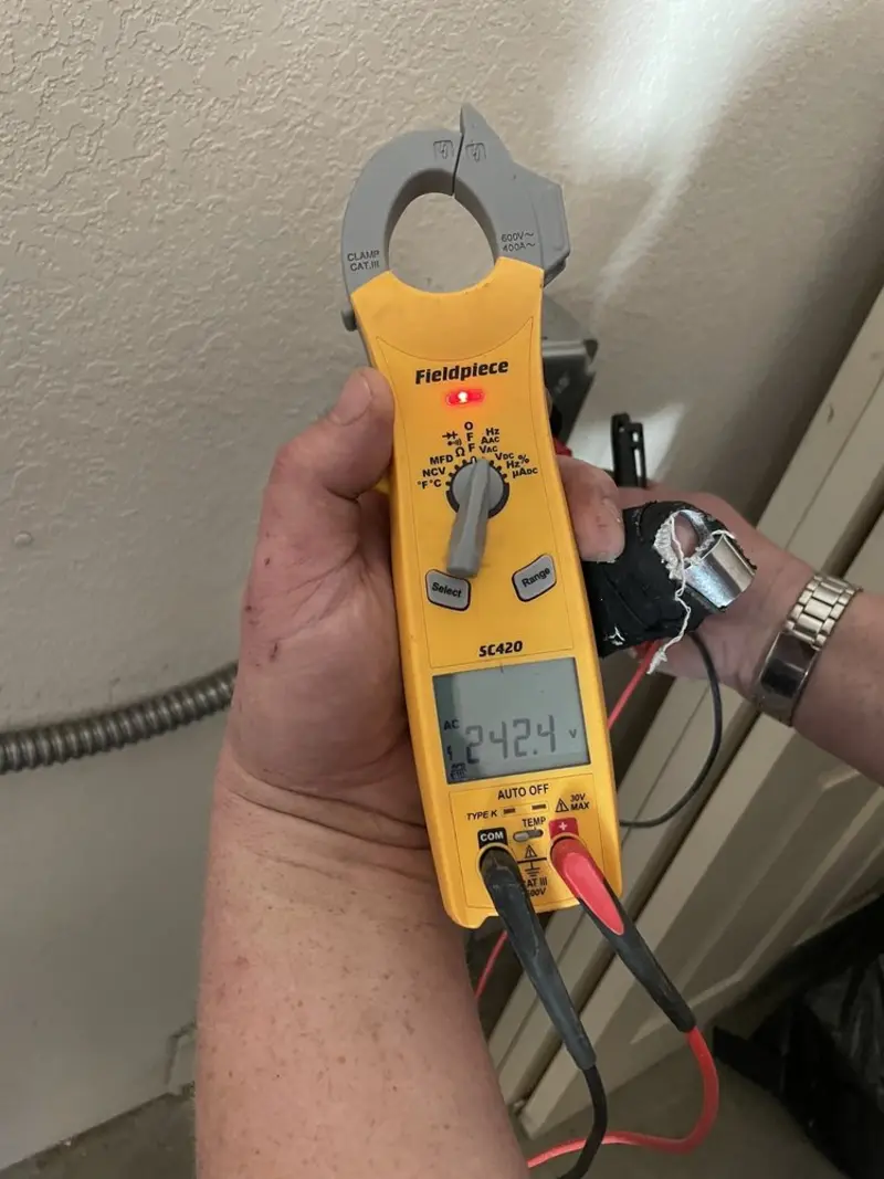 Voltage testing with clamp meter during Electrical Installation Services in Piney Green